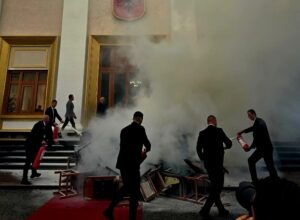 Opposition members set fire to chairs in the courtyard of Albania’s Parliament