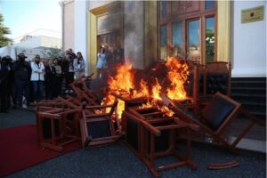 Opposition members set fire to chairs in the courtyard of Albania’s Parliament